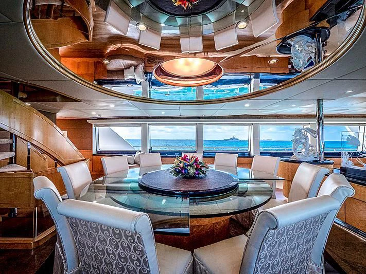 a room with a table and chairs aboard ISLAND HEIRESS Yacht for Charter