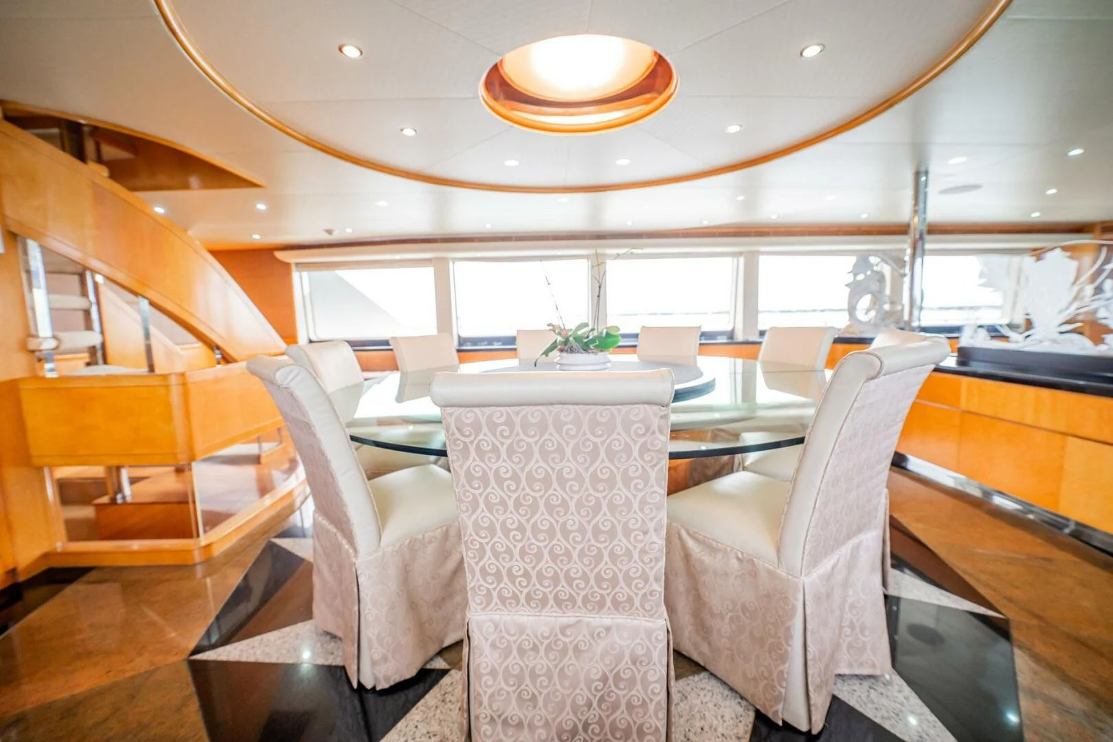a room with chairs and a table aboard ISLAND HEIRESS Yacht for Charter