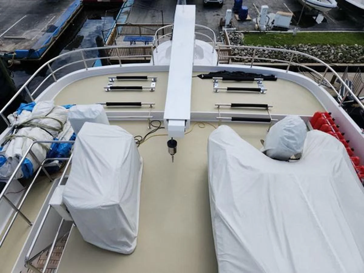 a large white boat with a white sail on it aboard ISLAND HEIRESS Yacht for Charter