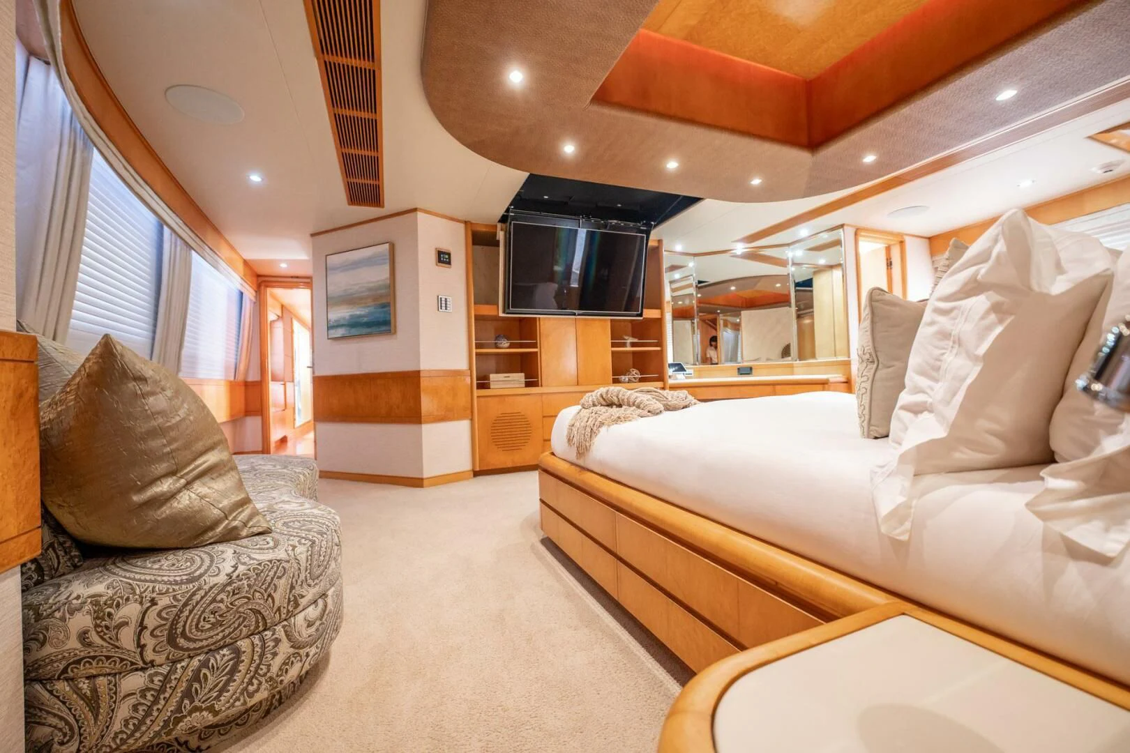 a room with a couch and a television aboard ISLAND HEIRESS Yacht for Charter