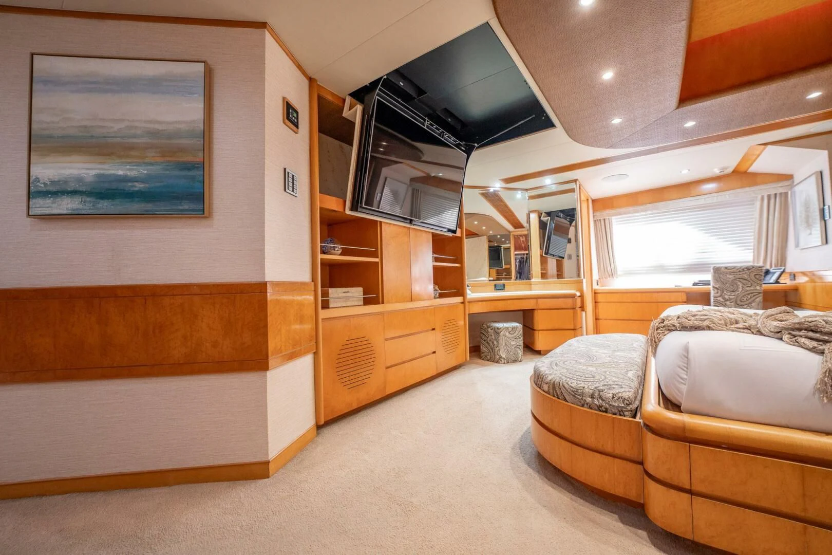 a room with a couch and a tv aboard ISLAND HEIRESS Yacht for Charter