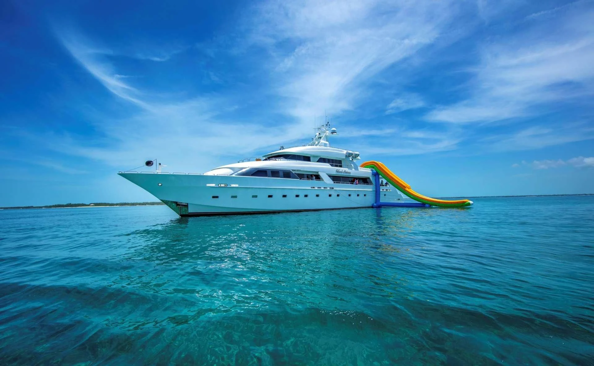 a white yacht in the water aboard ISLAND HEIRESS Yacht for Charter
