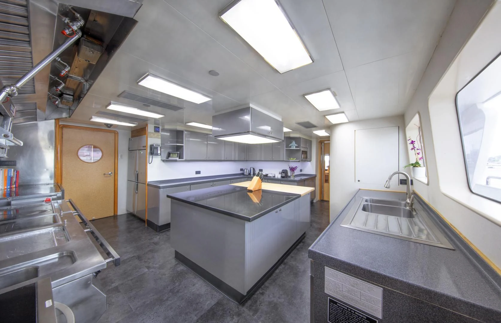 a large kitchen with stainless steel appliances aboard ISLAND HEIRESS Yacht for Charter