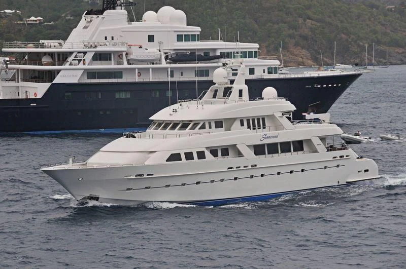 a couple of large boats in the water aboard ISLAND HEIRESS Yacht for Charter