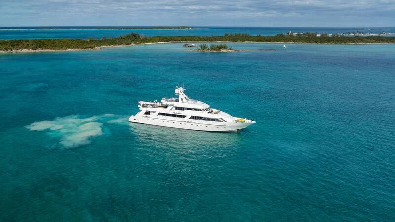 a white boat in the water aboard ISLAND HEIRESS Yacht for Charter