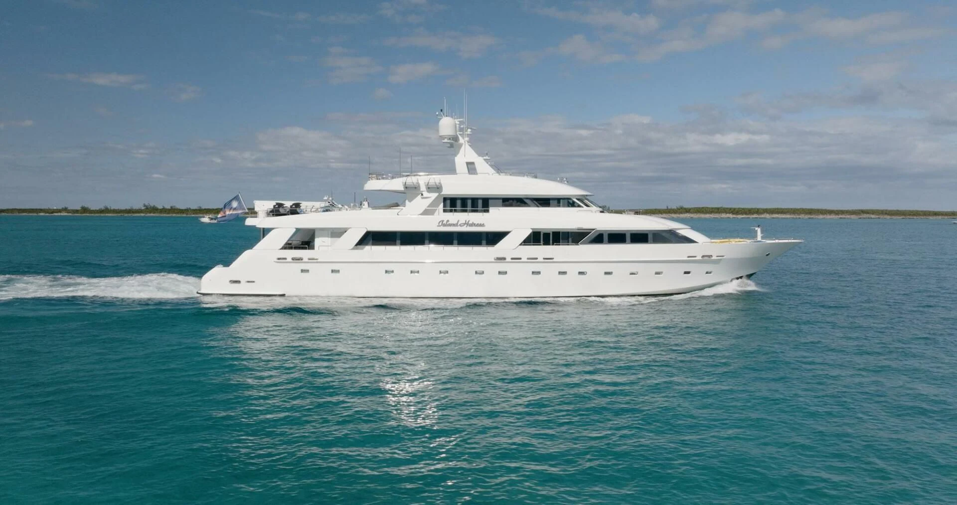 a white yacht in the water aboard ISLAND HEIRESS Yacht for Charter