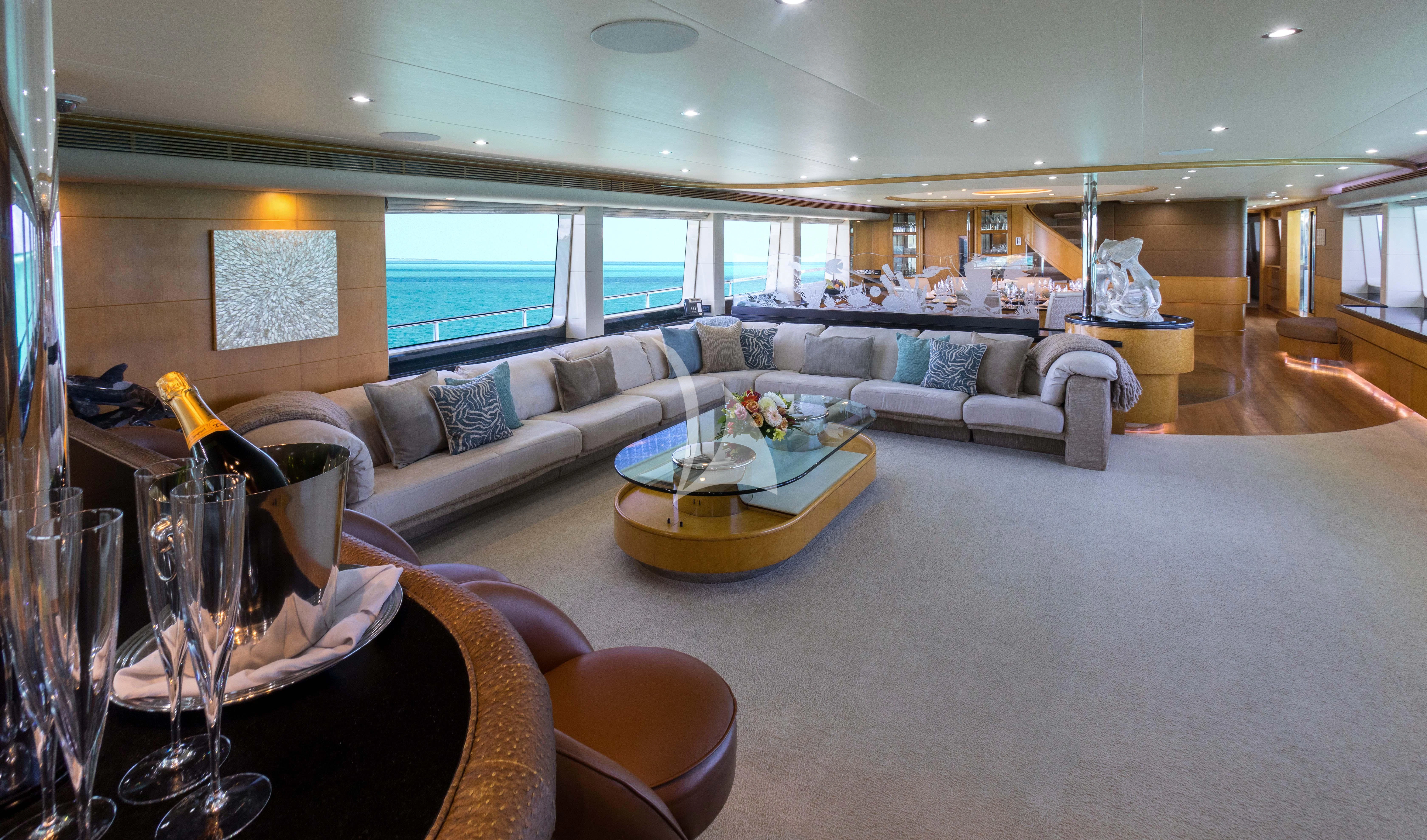 a living room with a couch and a table aboard ISLAND HEIRESS Yacht for Charter