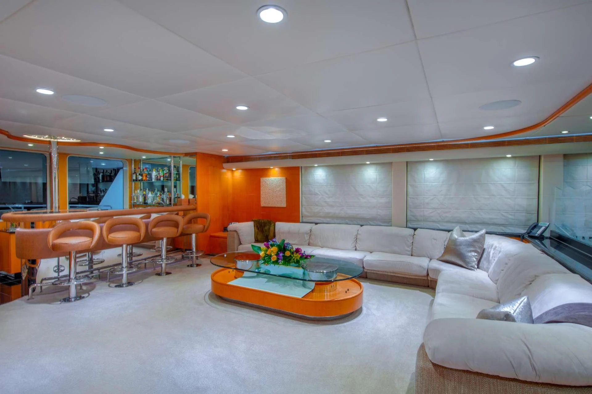 a living room with a large sofa aboard ISLAND HEIRESS Yacht for Charter