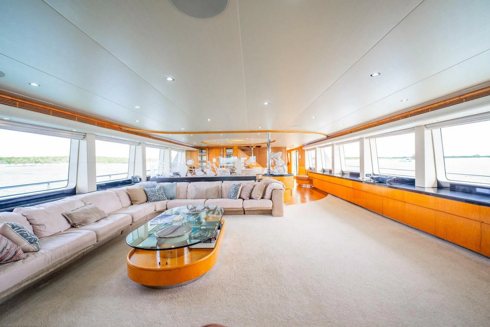 a living room with a couch and a coffee table aboard ISLAND HEIRESS Yacht for Charter