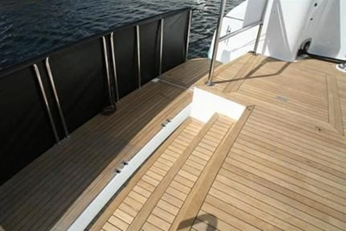 a wood floor with a black counter top aboard ISLAND HEIRESS Yacht for Charter