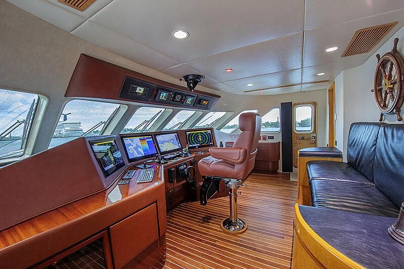 a room with a couch and a television aboard ISLAND HEIRESS Yacht for Charter