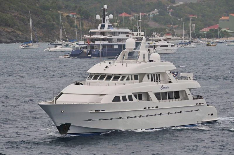 a large white boat in the water aboard ISLAND HEIRESS Yacht for Charter