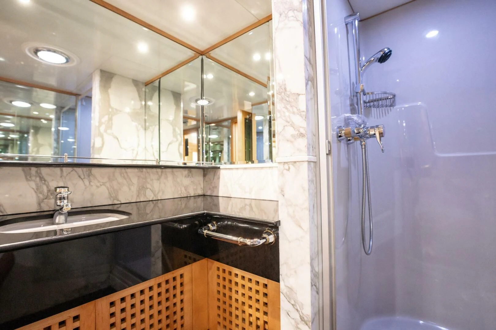 a bathroom with a sink and a mirror aboard ISLAND HEIRESS Yacht for Charter