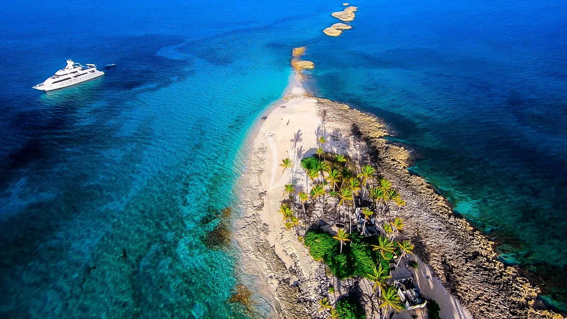 a beach with a beach and boats aboard ISLAND HEIRESS Yacht for Charter