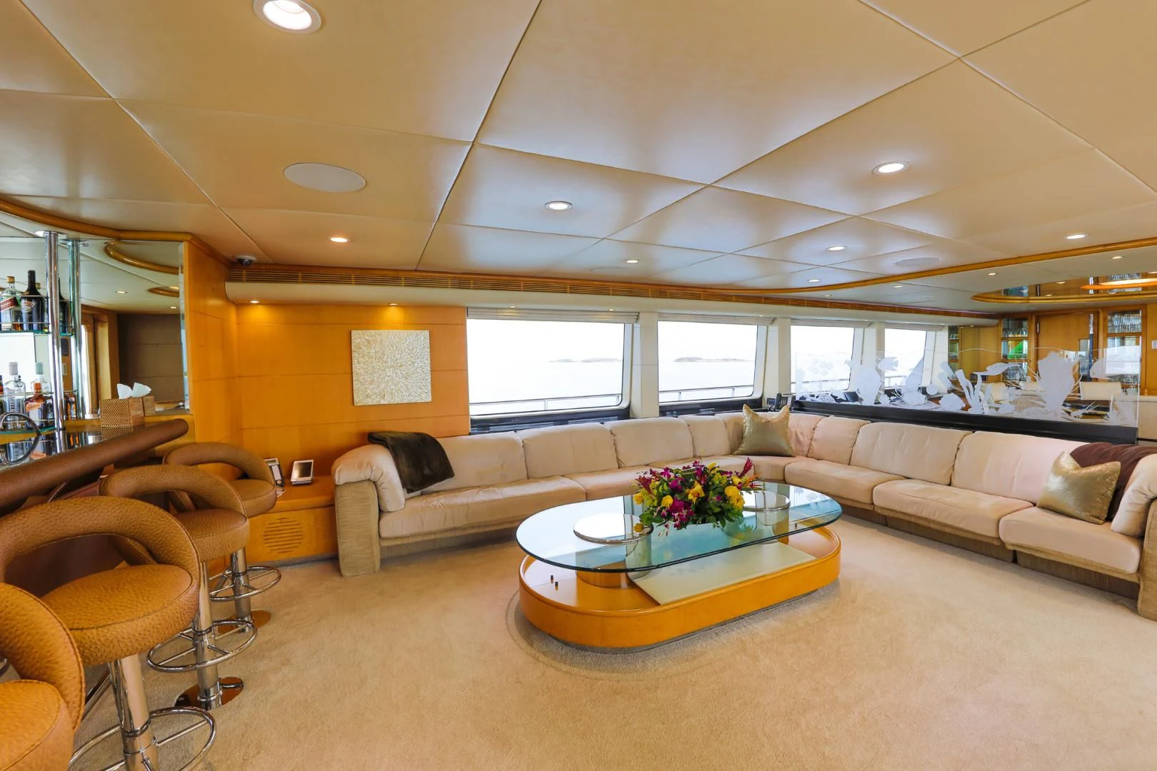 a living room with a large window aboard ISLAND HEIRESS Yacht for Charter