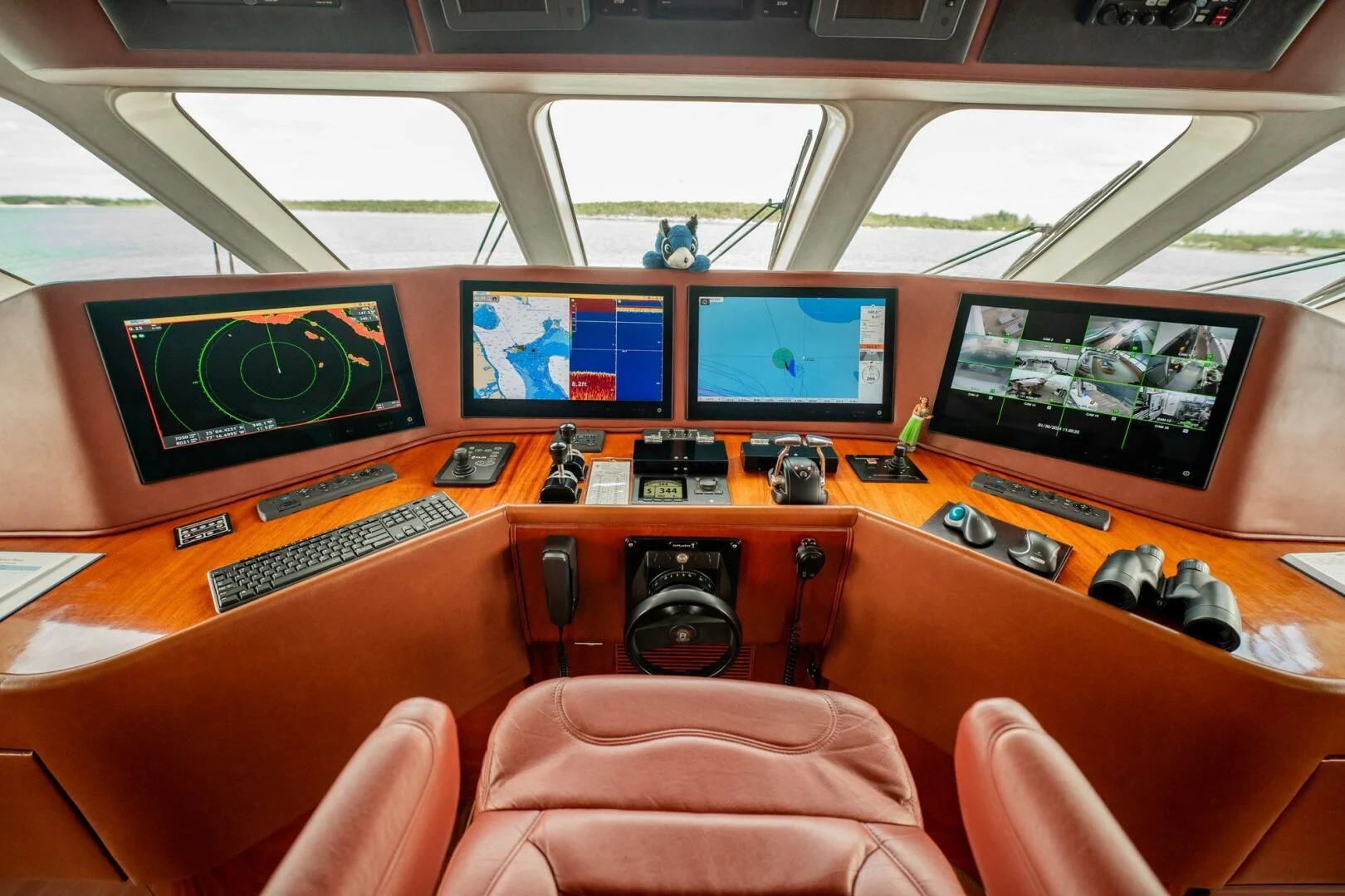 a control room with many monitors aboard ISLAND HEIRESS Yacht for Charter