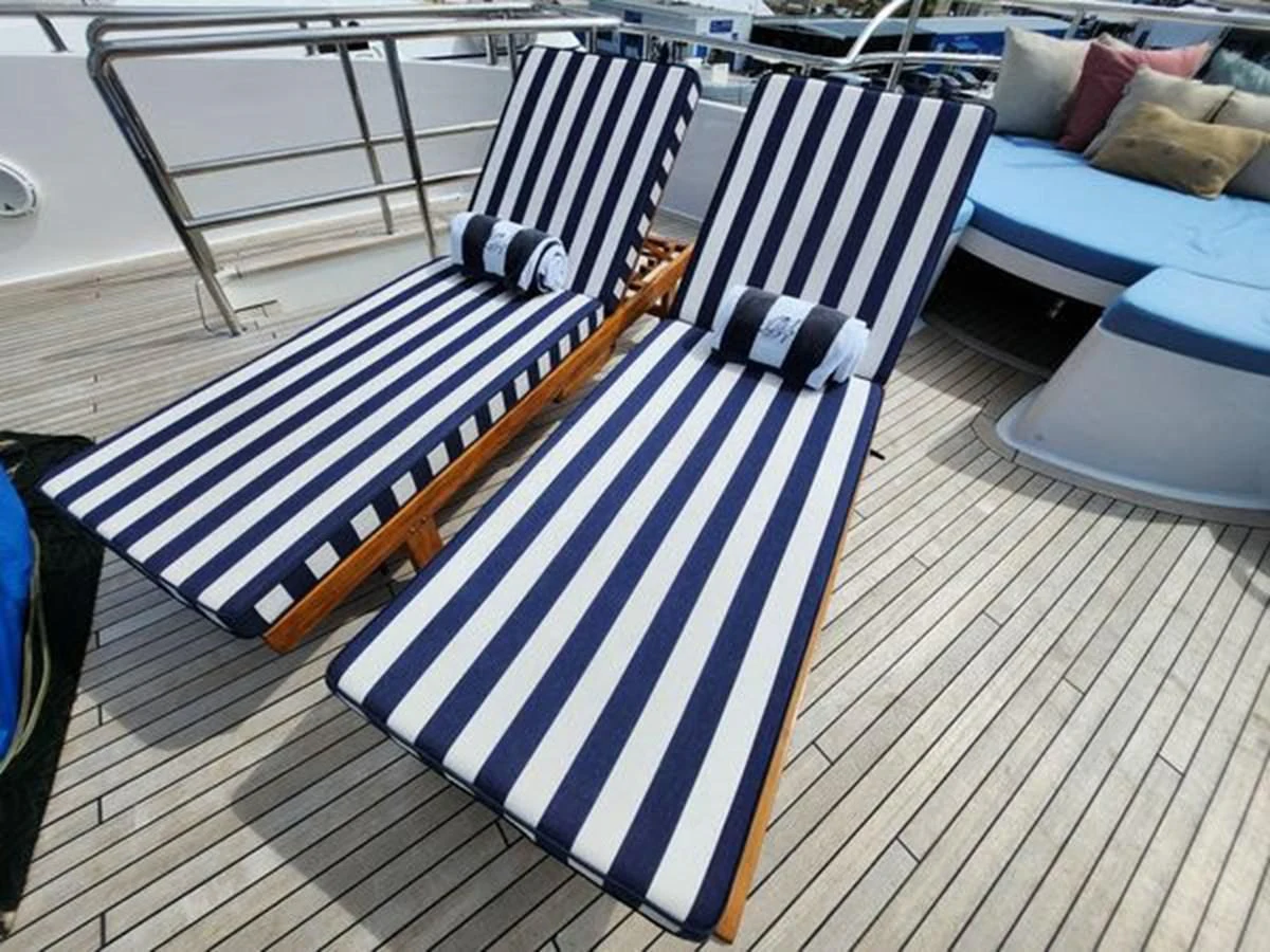 a blue and white striped object on a wooden deck aboard ISLAND HEIRESS Yacht for Charter