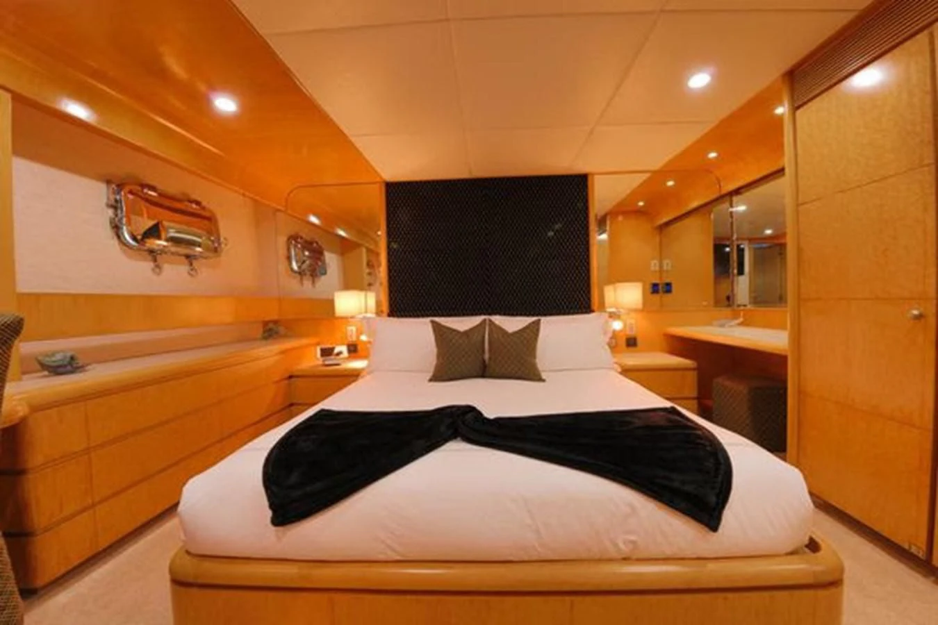 a hotel room with a large mirror aboard ISLAND HEIRESS Yacht for Charter