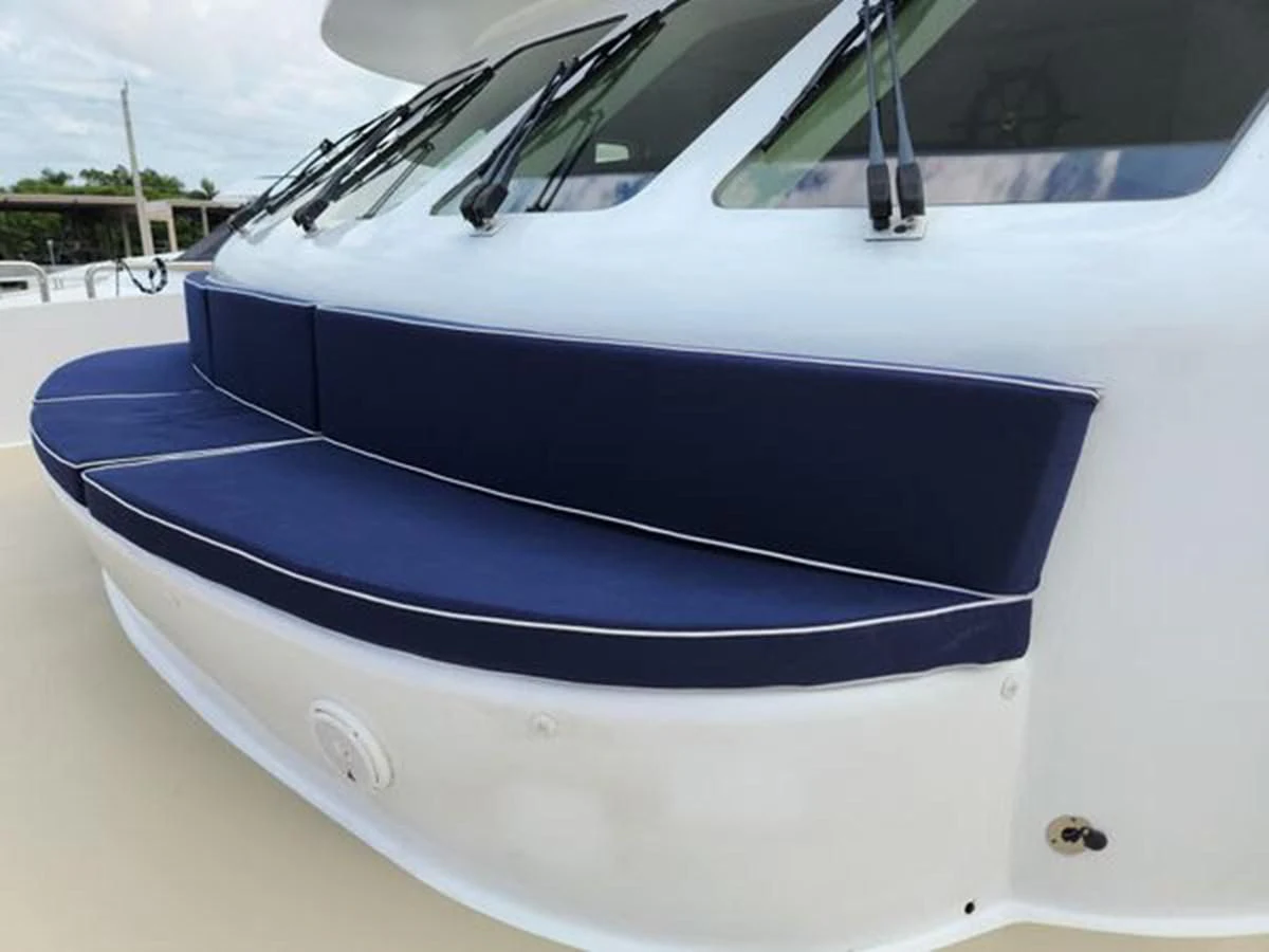 a white boat with blue stripes aboard ISLAND HEIRESS Yacht for Charter