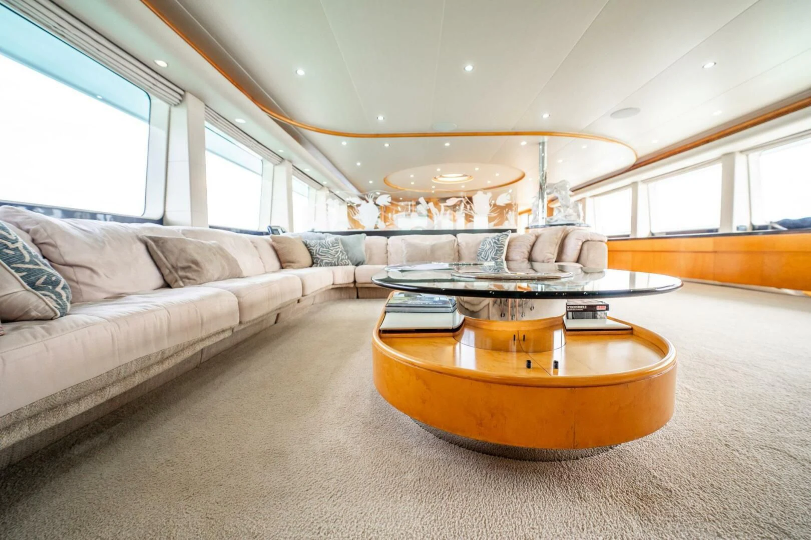 a living room with a large sofa aboard ISLAND HEIRESS Yacht for Charter