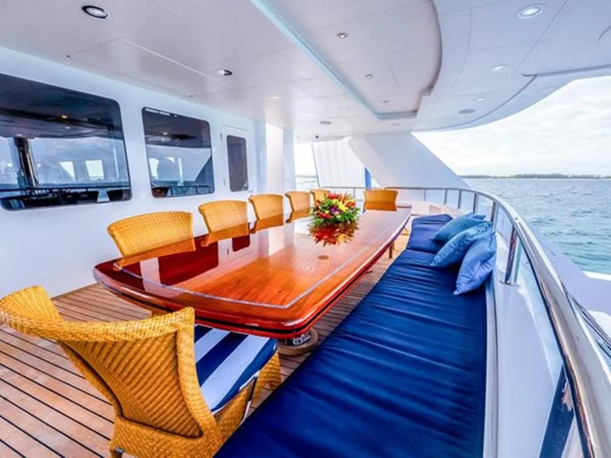 a boat with a table and chairs on it aboard ISLAND HEIRESS Yacht for Charter