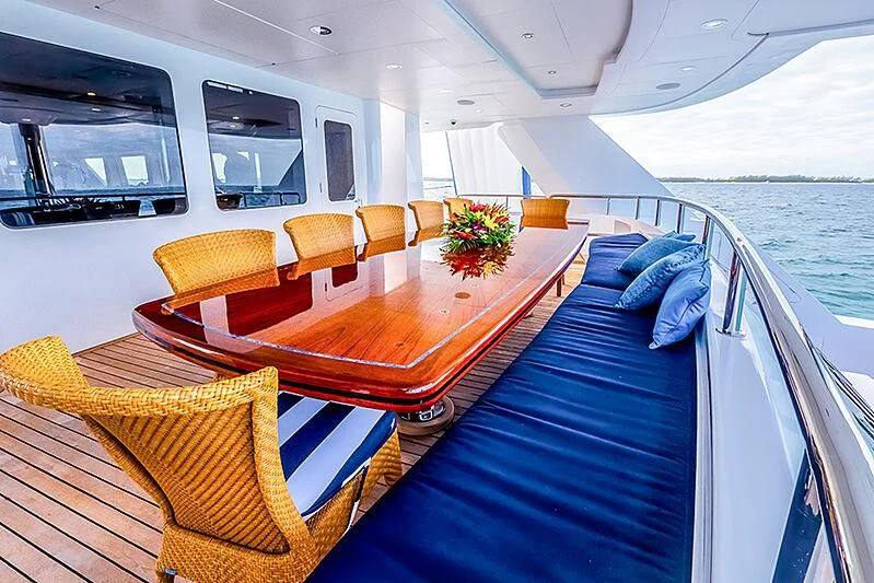 a room with a table and chairs aboard ISLAND HEIRESS Yacht for Charter