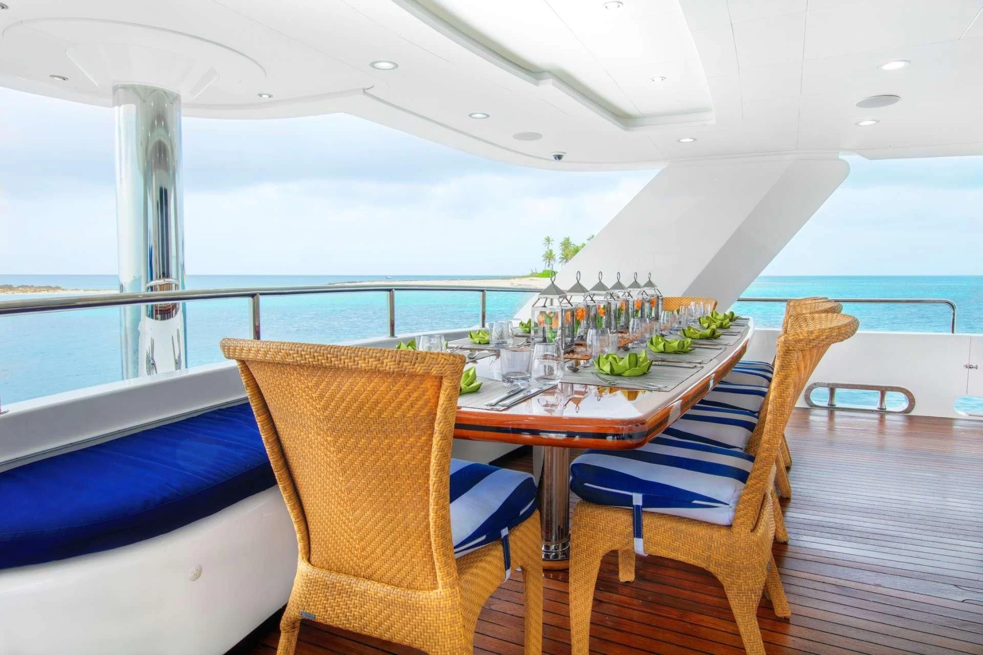 a table with chairs and a view of the ocean aboard ISLAND HEIRESS Yacht for Charter