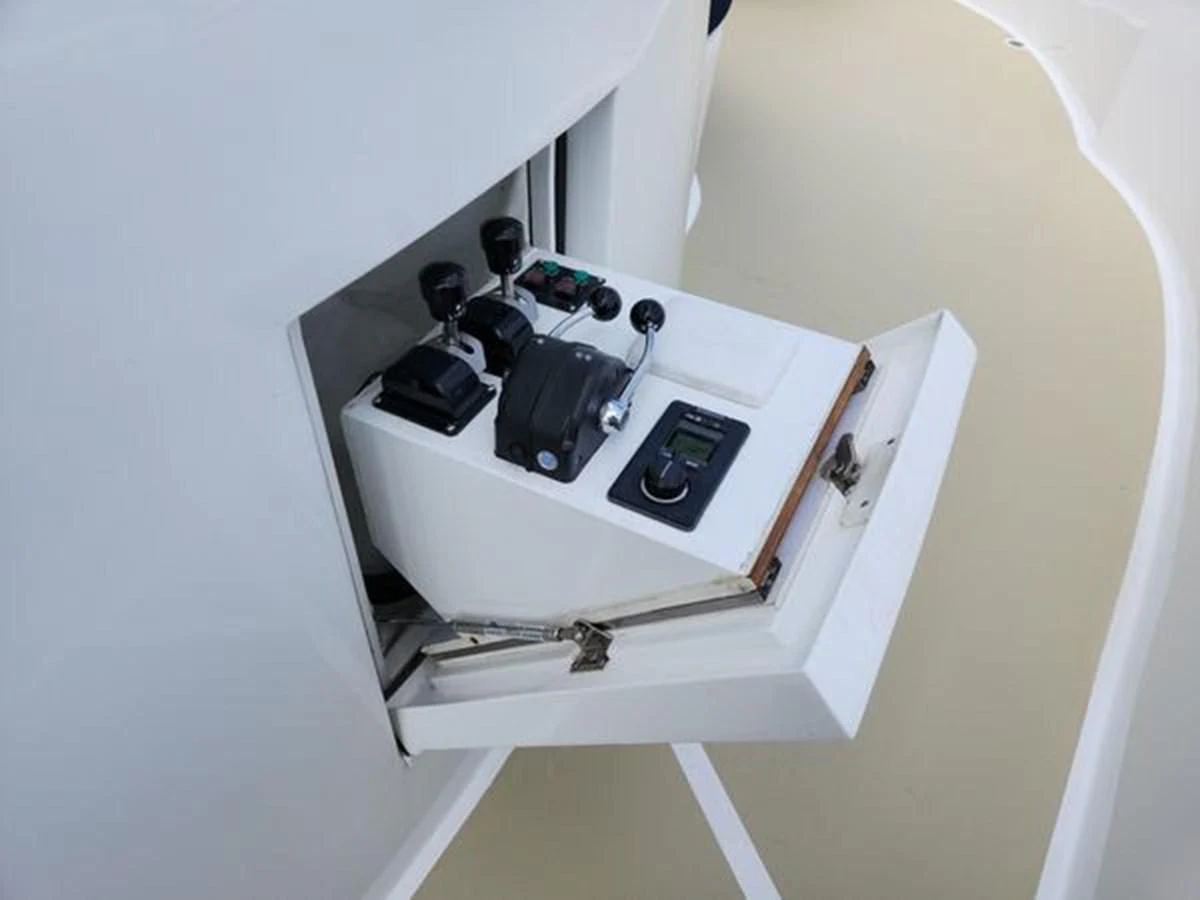 a white cabinet with a black object on it aboard ISLAND HEIRESS Yacht for Charter