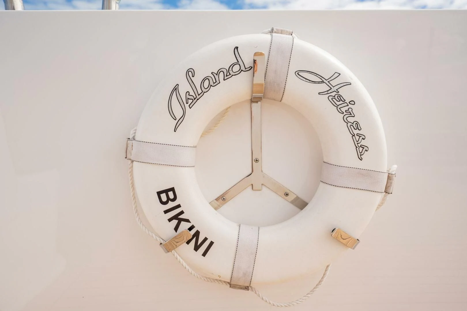 a white circular object with text aboard ISLAND HEIRESS Yacht for Charter