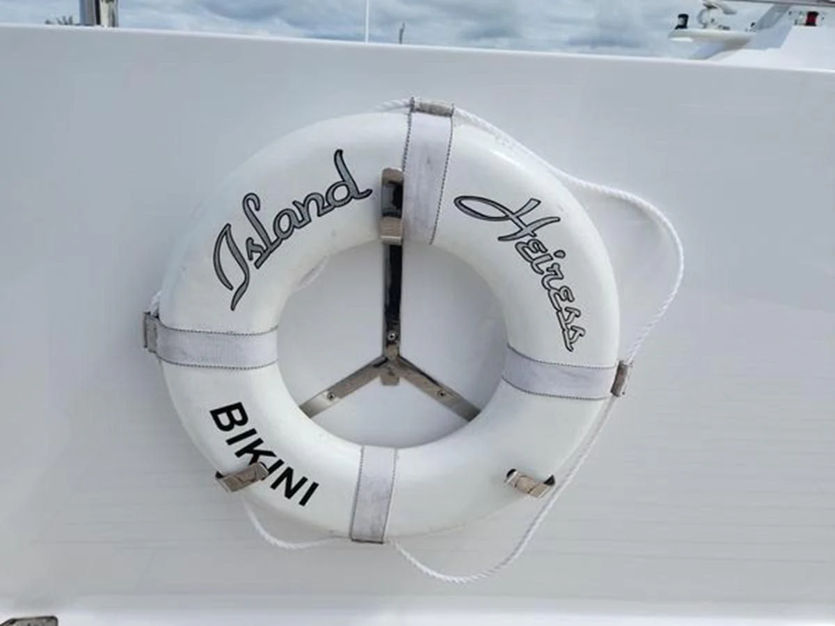 a white circular object with a black handle aboard ISLAND HEIRESS Yacht for Charter