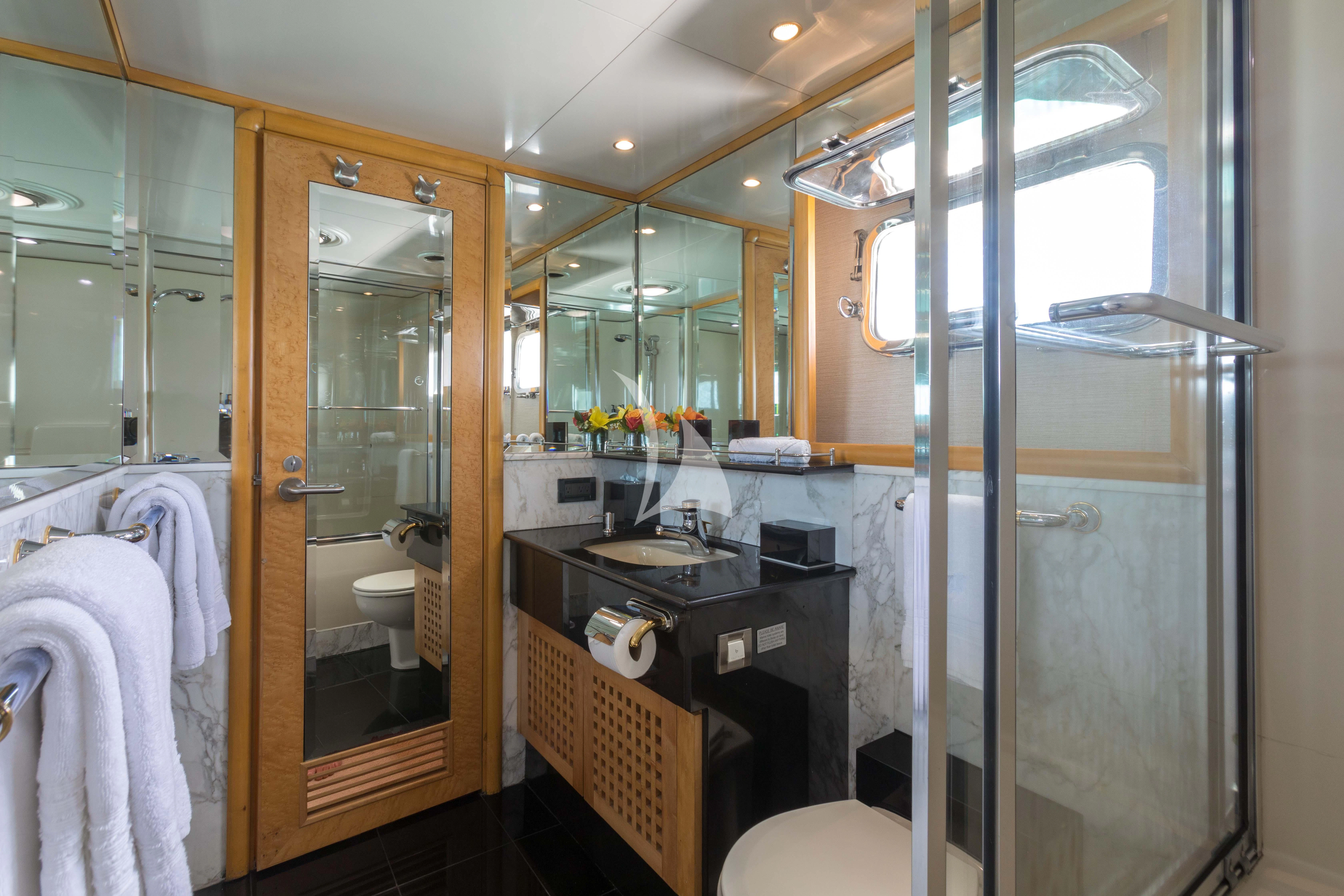 a bathroom with a glass shower aboard ISLAND HEIRESS Yacht for Charter