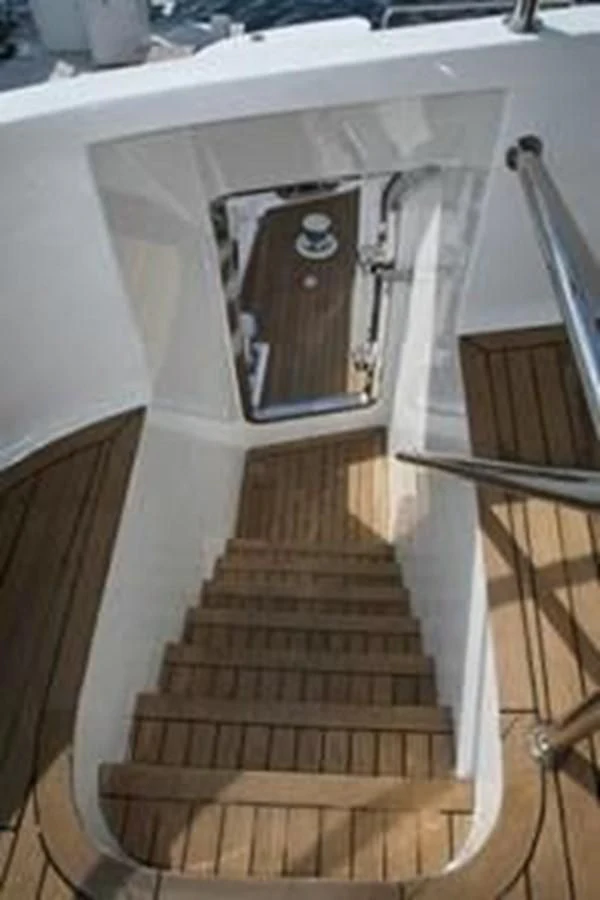 a white staircase with a round opening aboard ISLAND HEIRESS Yacht for Charter