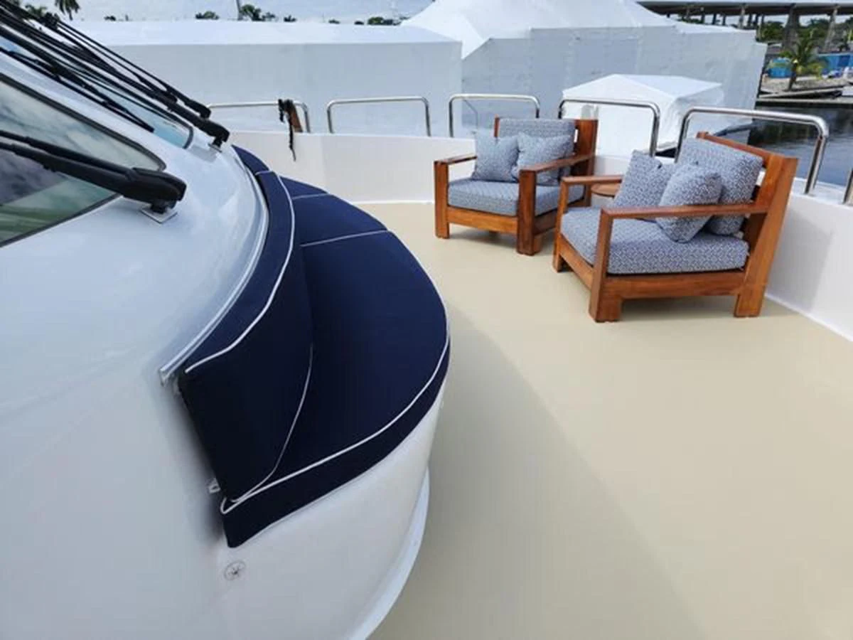 a black umbrella on a white table aboard ISLAND HEIRESS Yacht for Charter