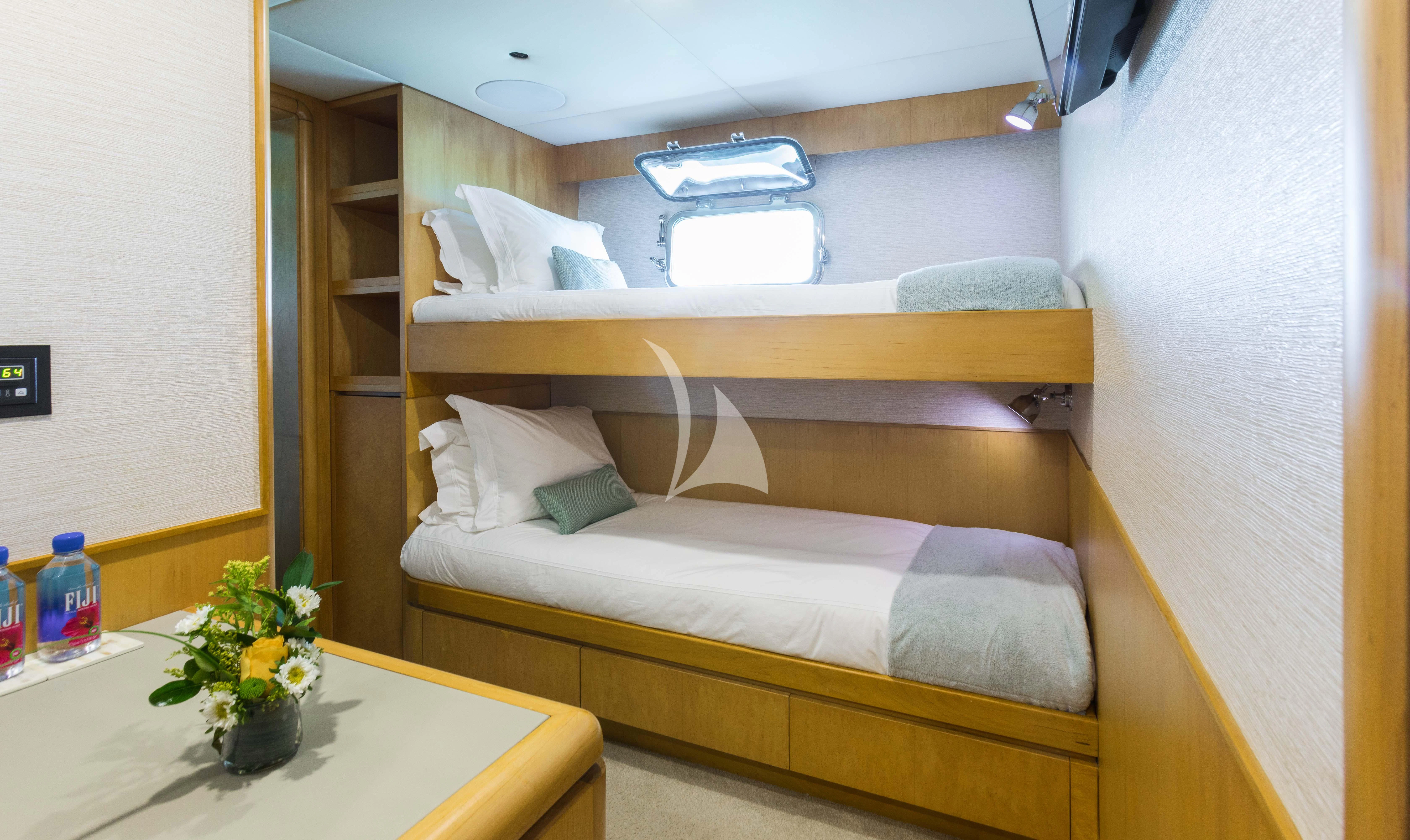 a bed with a flower pot on it aboard ISLAND HEIRESS Yacht for Charter