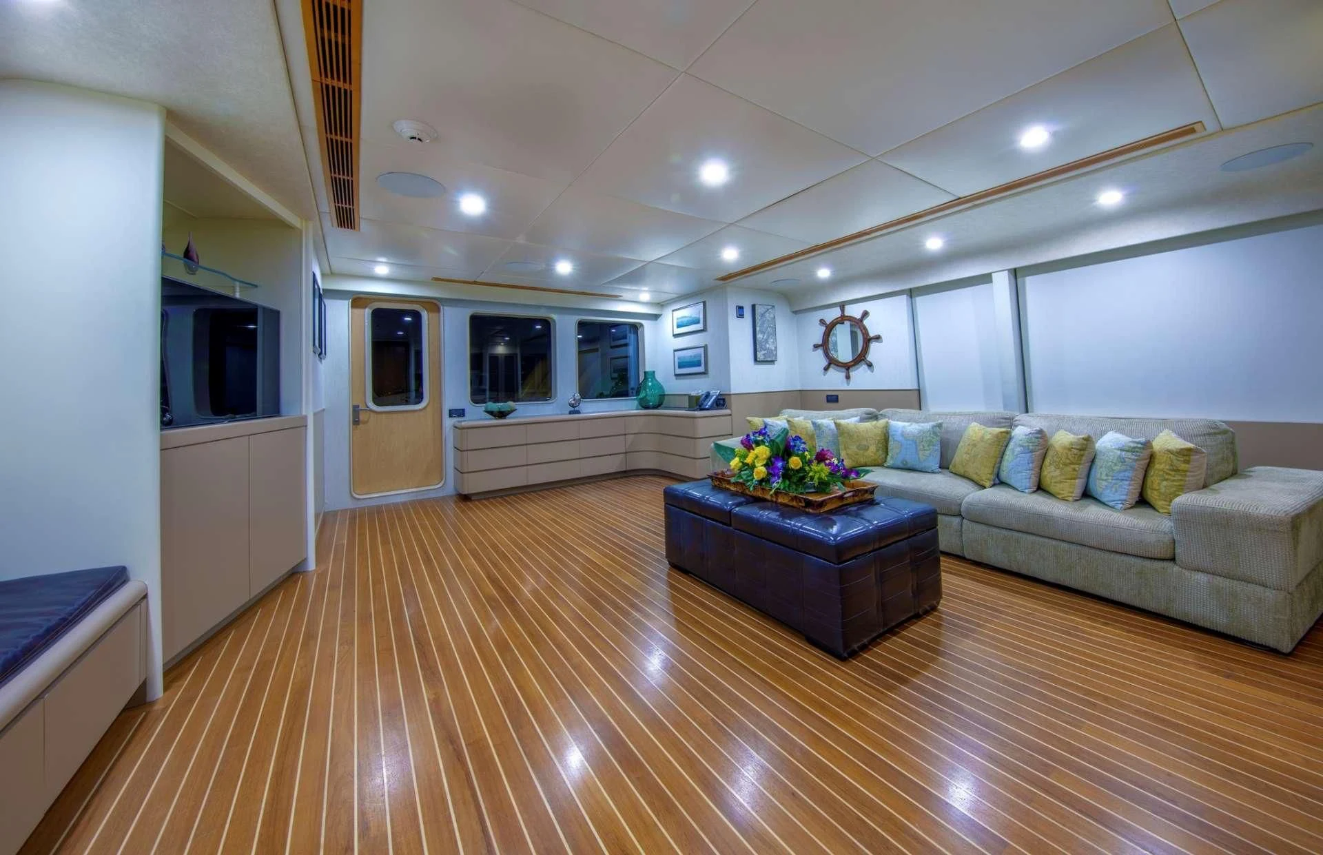 a living room with a couch and a table aboard ISLAND HEIRESS Yacht for Charter