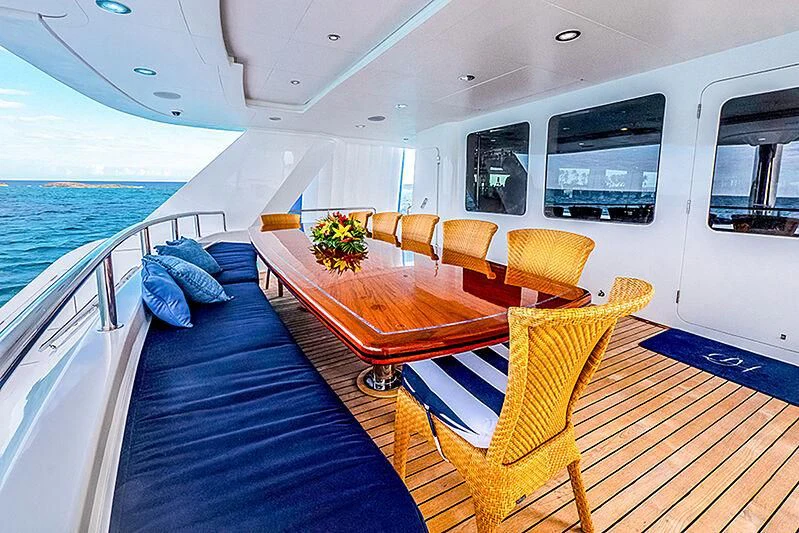 a boat with a table and chairs aboard ISLAND HEIRESS Yacht for Charter