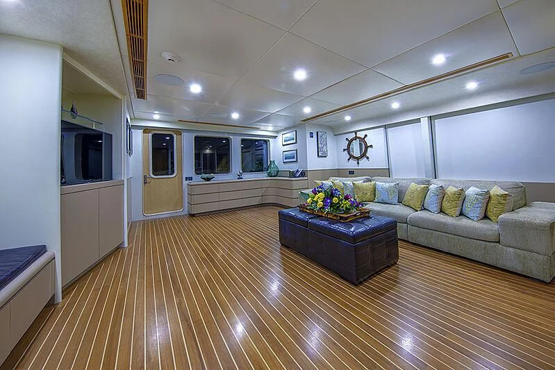 a living room with a large wood floor and a large wood floor aboard ISLAND HEIRESS Yacht for Charter