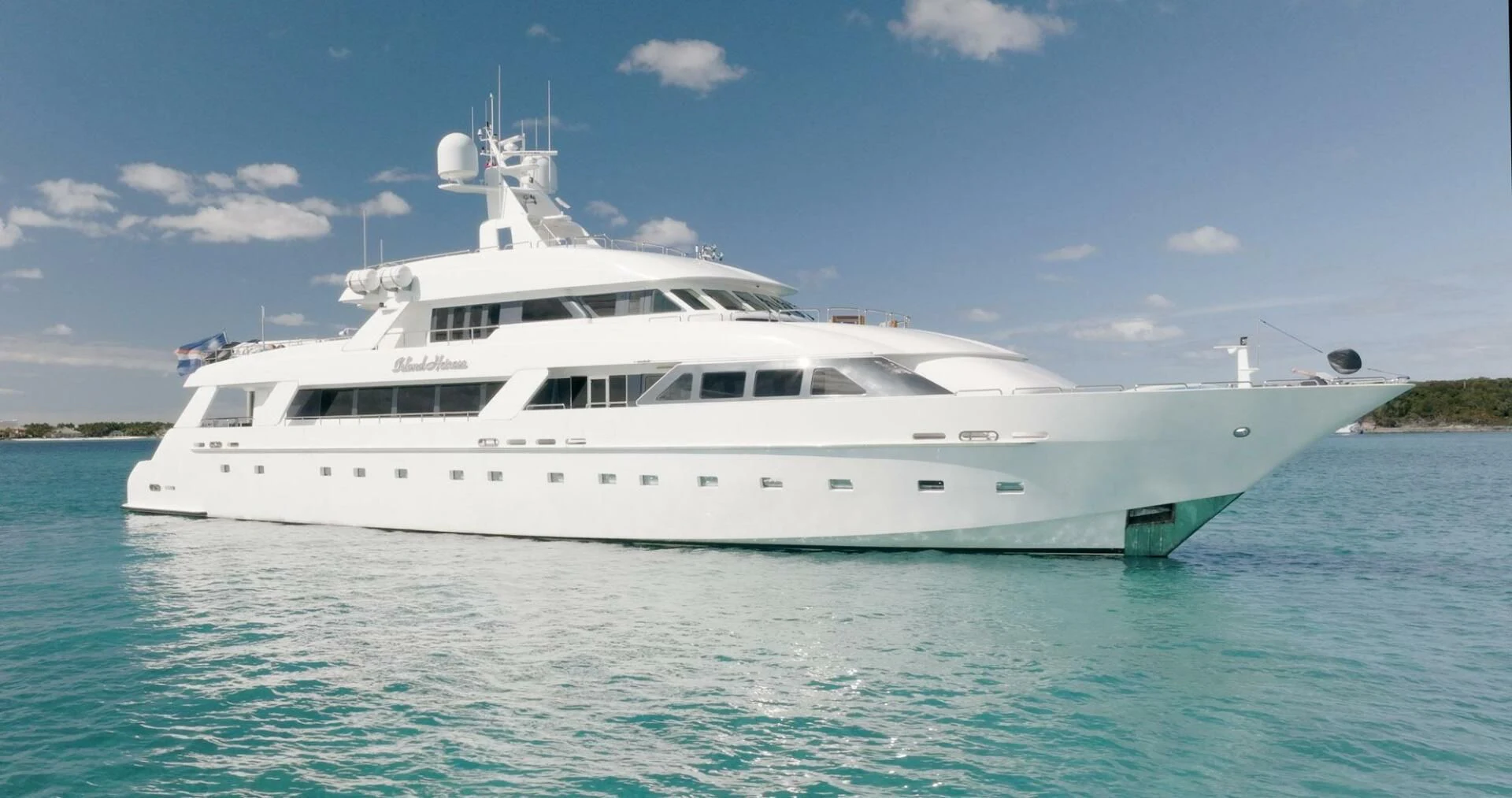 a white yacht in the water aboard ISLAND HEIRESS Yacht for Charter