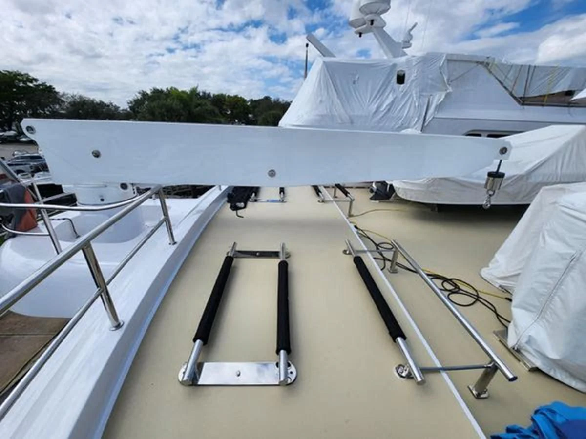 a white boat with a ladder aboard ISLAND HEIRESS Yacht for Charter