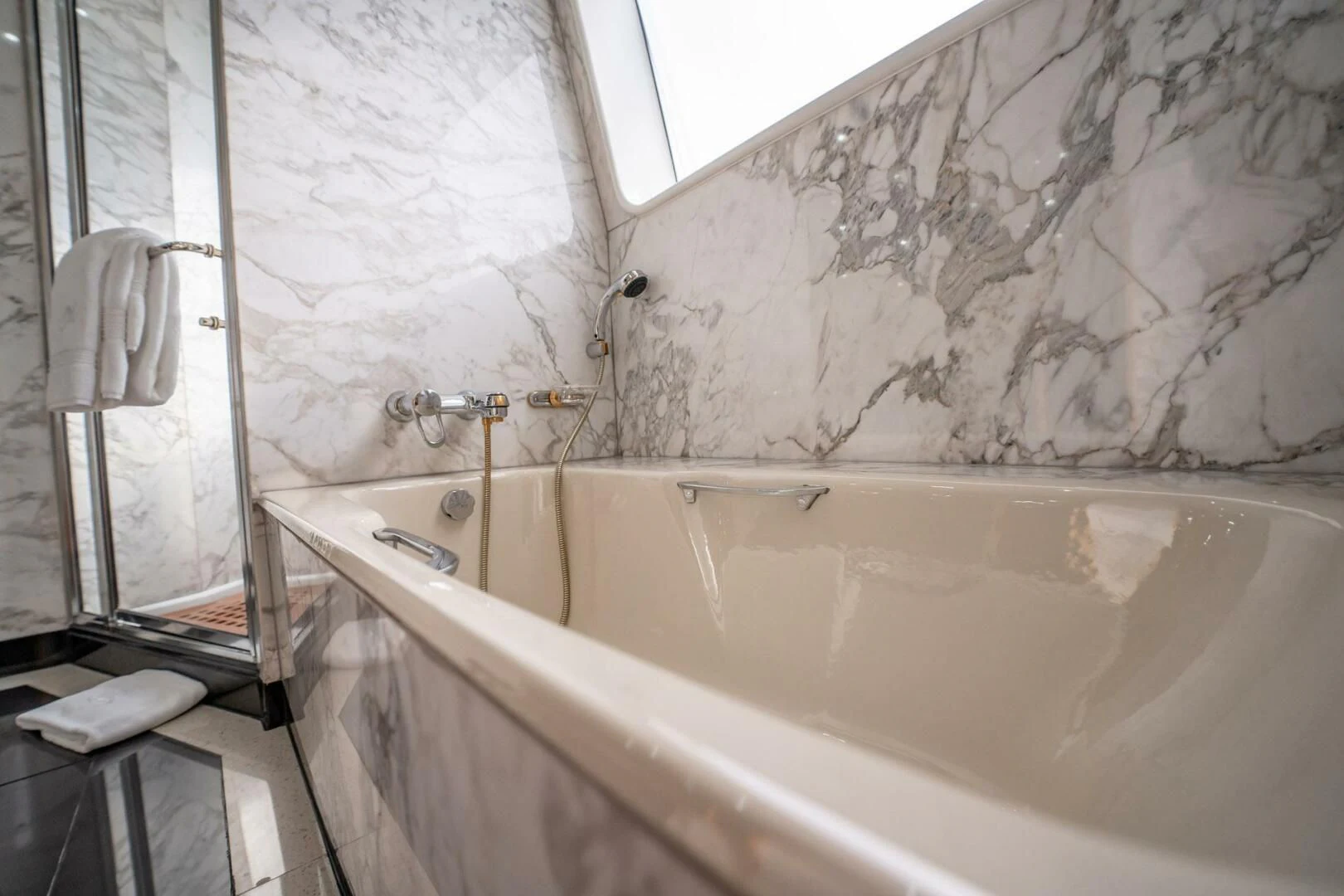 a bathtub with a shower curtain aboard ISLAND HEIRESS Yacht for Charter