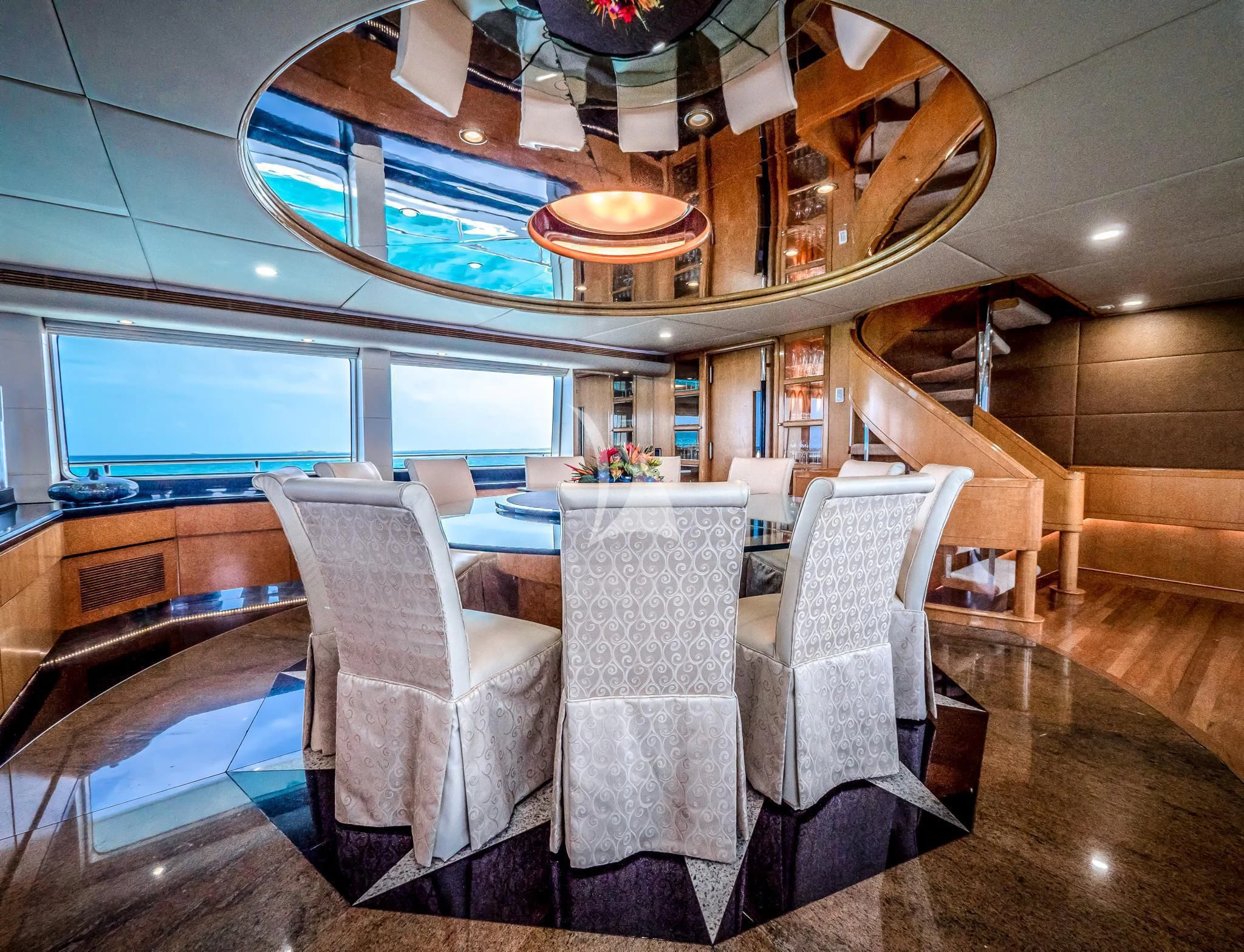 a room with chairs and a table aboard ISLAND HEIRESS Yacht for Charter