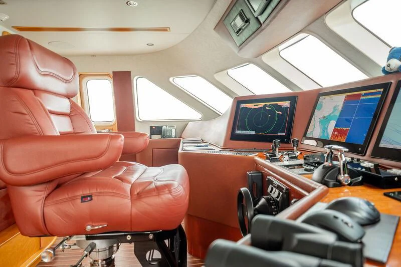 a room with a couple of monitors and a couple of computer screens aboard ISLAND HEIRESS Yacht for Charter