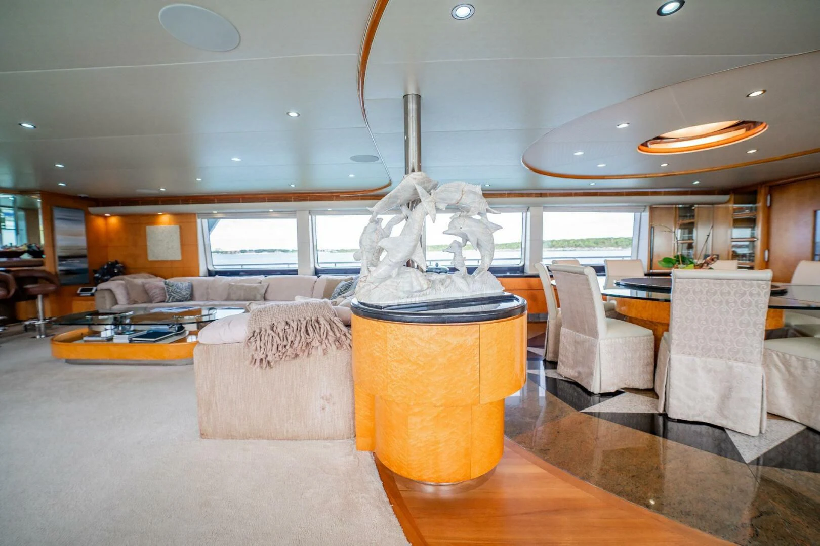 a room with a couch and a table and chairs aboard ISLAND HEIRESS Yacht for Charter