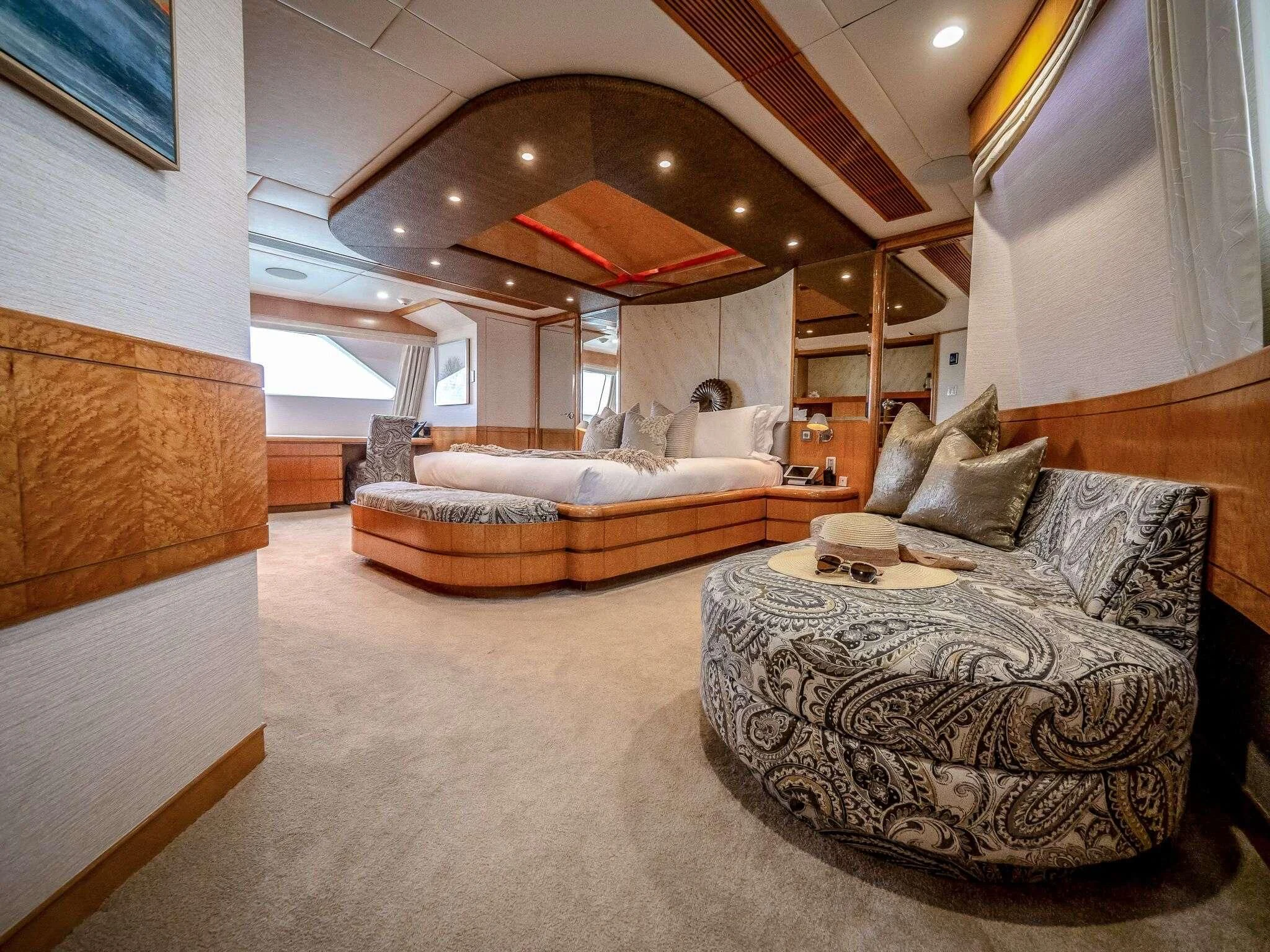 a room with couches and a table aboard ISLAND HEIRESS Yacht for Charter