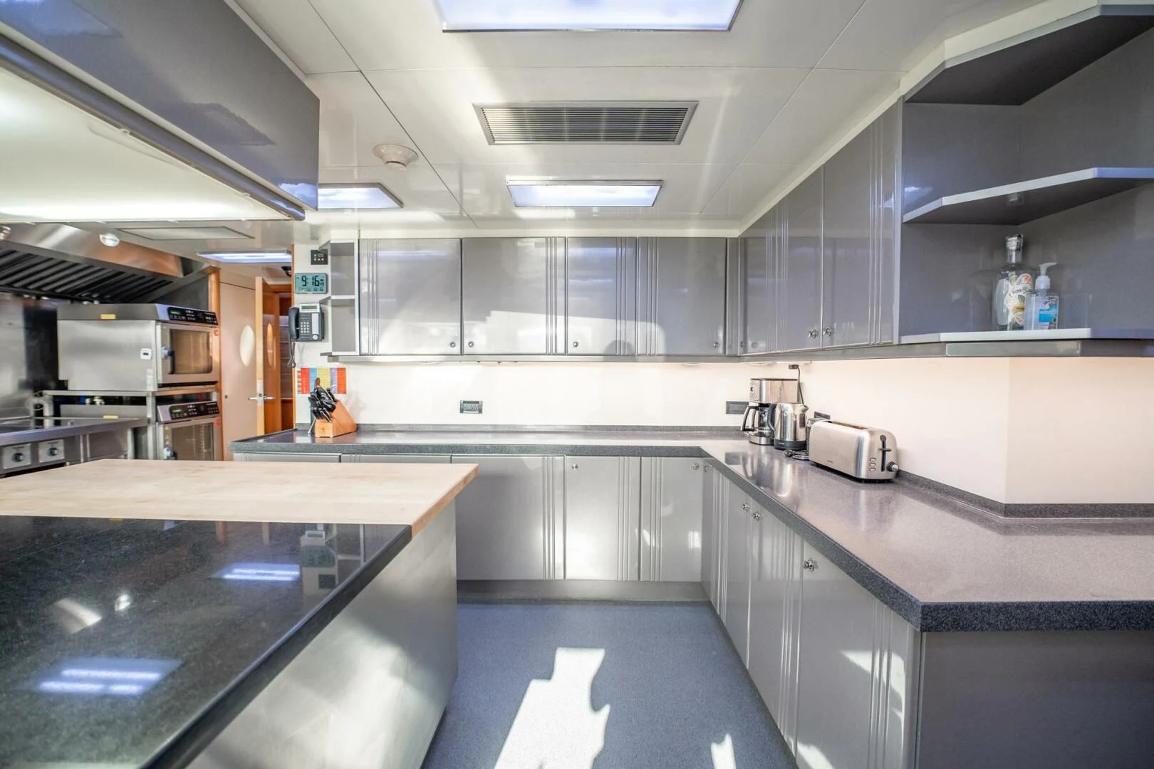 a kitchen with a counter and cabinets aboard ISLAND HEIRESS Yacht for Charter