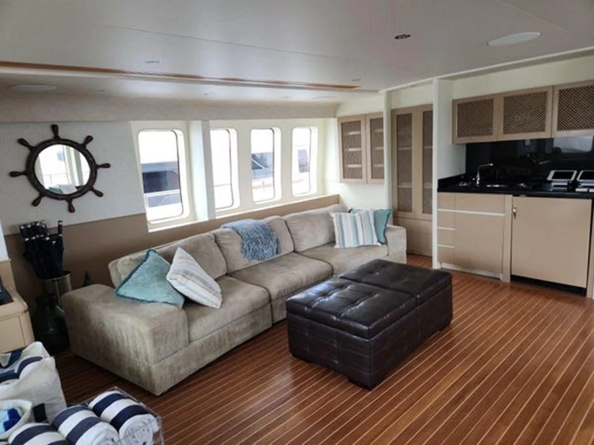 a living room with a leather couch aboard ISLAND HEIRESS Yacht for Charter