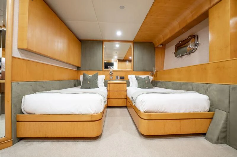 a room with two beds aboard ISLAND HEIRESS Yacht for Charter