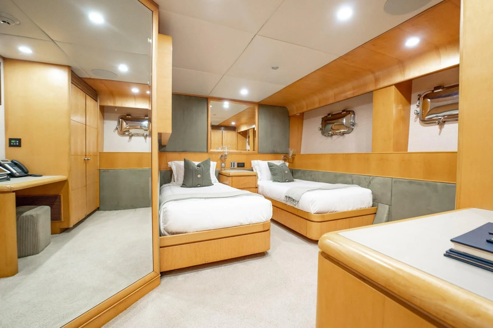 a room with a couple beds aboard ISLAND HEIRESS Yacht for Charter