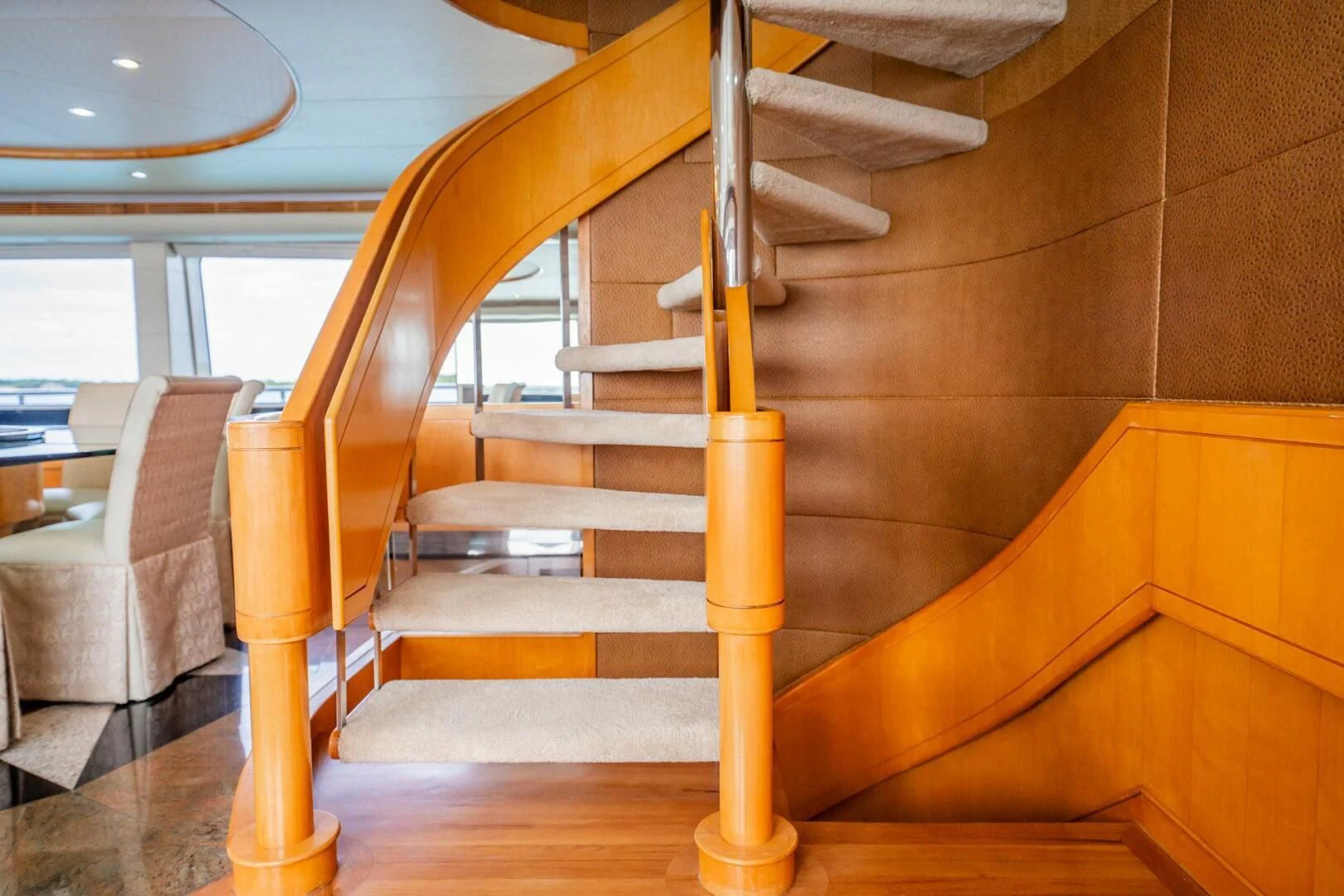 a wooden staircase with wooden railings aboard ISLAND HEIRESS Yacht for Charter