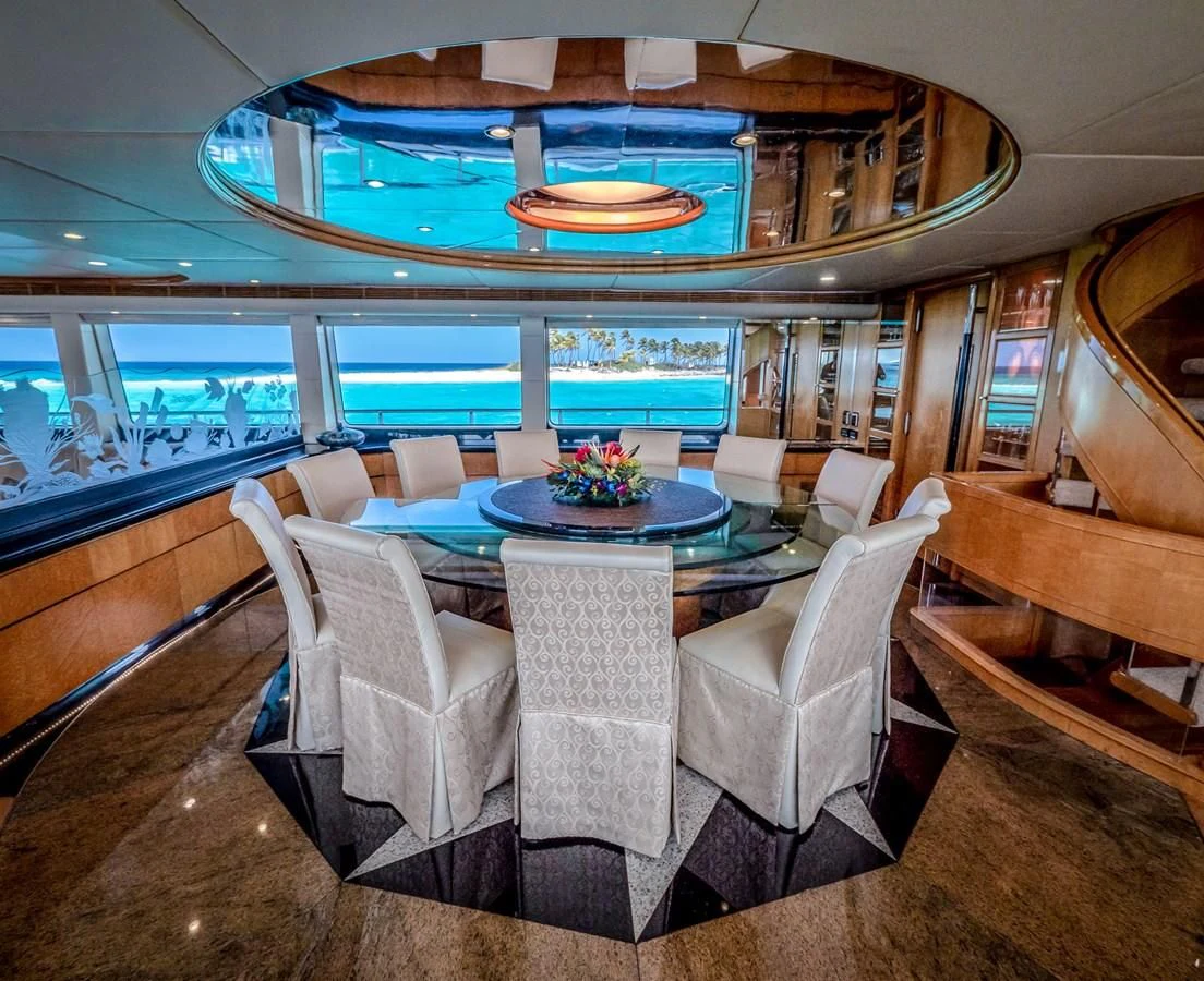 a room with a table and chairs aboard ISLAND HEIRESS Yacht for Charter